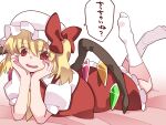  1girl ascot bed blonde_hair blush bow flandre_scarlet frills gem hair_bow hammer_(sunset_beach) hands hat hat_bow highres legs_up lying on_stomach red_eyes side_ponytail skirt solo touhou translation_request white_legwear wings 