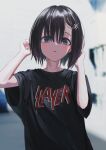  1girl absurdres black_shirt blue_eyes blurry blurry_background blush bob_cut bright_pupils brown_hair depth_of_field hands_up highres looking_at_viewer medium_hair merchandise nadegata original parted_lips revision shirt short_sleeves slayer_(band) solo ss_insignia white_pupils 