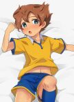  1boy blue_eyes blurry blush brown_hair chokutsuu_(menino) depth_of_field highres inazuma_eleven_(series) inazuma_eleven_go knees looking_at_viewer lying male_focus matsukaze_tenma navel on_back open_mouth raimon raimon_soccer_uniform soccer_uniform solo sportswear sweat 