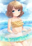  1girl ahoge bare_arms bare_shoulders beach bikini blue_eyes blue_sky brown_hair clouds collarbone commentary_request day frilled_bikini frills highres idolmaster idolmaster_million_live! innertube looking_at_viewer navel ocean outdoors sand short_hair sky solo sorashima_(117) suou_momoko swimsuit thighs water waves wet yellow_bikini 