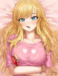  1girl artist_name bangs bed_sheet blonde_hair blue_eyes blush breasts closed_mouth collarbone commentary_request crossed_arms eyebrows_visible_through_hair food food_in_mouth heart heart_print highres idolmaster idolmaster_cinderella_girls large_breasts long_hair looking_at_viewer lying messy_hair nhaliz on_back ootsuki_yui pink_shirt pocky pocky_day print_shirt shirt short_sleeves signature solo t-shirt upper_body 