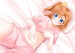  1girl :o asakawa-san_(8107ka) bangs bed_sheet belly_poke blue_eyes blush bow breasts collarbone commentary_request cowboy_shot dutch_angle eyebrows_visible_through_hair finger_in_navel hair_between_eyes hair_bow highres kousaka_honoka lifted_by_self looking_down love_live! love_live!_school_idol_project lying medium_breasts navel navel_insertion navel_poking on_back one_side_up orange_hair pajamas pillow pink_shorts shirt_lift short_sleeves shorts sidelocks solo stomach yellow_bow 