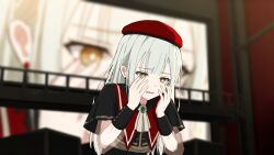  1girl ascot bang_dream! bang_dream!_it's_mygo!!!!! beret black_capelet blurry blurry_background brooch brown_eyes capelet chain's commentary english_commentary green_hair hands_on_own_face hands_up hat highres indoors jewelry long_hair looking_down mortis_(bang_dream!) mortis_(costume)_(bang_dream!) open_mouth red_hat scared screen solo stage subtitled textless_version upper_body wakaba_mutsumi white_ascot 