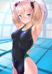  1girl armpits arms_up blonde_hair blue_eyes blurry blurry_background blush bow breasts closed_mouth competition_swimsuit covered_navel depth_of_field hair_between_eyes hair_bow highres indoors medium_breasts nanahime one-piece_swimsuit original poolside solo swimsuit twintails undressing wet 