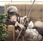  1girl apron bangs black_hair broom collared_shirt couch eyebrows_visible_through_hair frills green_eyes highres holding holding_broom kim_eb long_hair lying maid maid_apron maid_headdress original plant shirt waist_apron window wrist_cuffs 