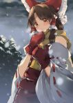  1girl :o blush bow brown_eyes brown_hair cold detached_sleeves gloves hair_bow hair_tubes hakurei_reimu highres long_hair looking_at_viewer meji_aniki outdoors red_bow red_gloves red_skirt red_vest ribbon-trimmed_sleeves ribbon_trim scarf sidelocks skirt skirt_set snowing solo touhou vest winter yellow_scarf 