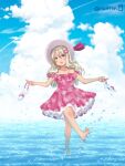  15citron 1girl alternate_costume barefoot blonde_hair blue_sky clouds commentary_request condensation_trail day dress frilled_dress frills grecale_(kancolle) green_eyes hair_ornament hairclip hat highres horizon kantai_collection long_hair ocean outdoors pink_dress shoes_removed sky solo sun_hat wading water wavy_hair white_headwear 