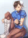  1girl black_mutou blue_background blue_dress blush boots bracelet breasts brown_eyes brown_hair brown_legwear bun_cover china_dress chinese_clothes chun-li cross-laced_footwear double_bun dress earrings gradient gradient_background jewelry lips medium_breasts pantyhose pelvic_curtain puffy_short_sleeves puffy_sleeves sash shoelaces short_sleeves sitting solo spiked_bracelet spikes street_fighter white_footwear 