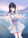  1girl bangs beach black_hair blue_eyes bracelet clouds commentary_request dot_nose dress eyebrows_visible_through_hair footprints highres idolmaster idolmaster_shiny_colors jadeqilin jewelry kazano_hiori long_hair mole mole_under_mouth ponytail smile white_dress 