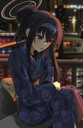  1girl alternate_costume black_hair blue_archive blue_eyes blue_hairband blue_kimono blue_ribbon blush brown_halo feet_out_of_frame floral_print floral_print_kimono hair_bun hairband halo highres japanese_clothes kimono long_sidelocks looking_down night obi obiage obijime open_mouth outdoors photo_background print_kimono railing renirum_14 ribbon sash sidelocks single_hair_bun sitting solo ui_(blue_archive) wide_sleeves 