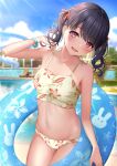  1girl :d bare_arms bare_shoulders bikini black_hair blurry blurry_background blush breasts brown_bikini collarbone commentary_request day depth_of_field floral_print fukumaru_koito hair_ribbon halter_top halterneck hand_up head_tilt highres idolmaster idolmaster_shiny_colors innertube karu_(qqqtyann) looking_at_viewer navel open_mouth orange_ribbon outdoors print_bikini ribbon small_breasts smile solo standing striped striped_ribbon swimsuit twintails violet_eyes 