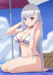  1girl azur_lane basket beach beach_umbrella belfast_(azur_lane) blue_eyes blush bracelet breasts chinese_commentary choker clouds cloudy_sky commentary_request eyebrows_visible_through_hair feet highres jewelry large_breasts lemon_kele long_hair looking_at_viewer navel ocean silver_hair sky smile solo swimsuit towel umbrella 