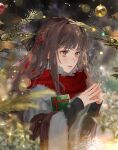  1girl bad_id bad_twitter_id black_sweater blurry blurry_background blurry_foreground braid brown_eyes brown_hair christmas_ornaments christmas_tree closed_mouth depth_of_field gift hands_up highres holding long_hair long_sleeves original red_scarf sankomichi scarf solo steepled_fingers sweater 