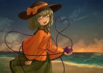 1girl absurdres arm_at_side arm_up beach black_headwear closed_eyes clouds collar commentary cowboy_shot ekaapetto facing_viewer frilled_shirt_collar frilled_sleeves frills gradient_sky green_collar green_hair green_skirt hat hat_ribbon heart heart_of_string highres holding horizon komeiji_koishi long_sleeves mixed-language_commentary ocean open_mouth outdoors ribbon shirt short_hair skirt sky smile solo standing sunset third_eye touhou wide_sleeves yellow_shirt 