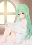  1girl bangs bare_legs bare_shoulders barefoot bed_sheet blurry blurry_background blush collared_shirt depth_of_field eyebrows_visible_through_hair feet_out_of_frame green_hair hair_between_eyes highres indoors knees_up leg_hug long_hair long_sleeves looking_at_viewer naked_shirt off_shoulder original parted_lips red_eyes roido_(taniko-t-1218) round_window shirt sitting sleeves_past_wrists solo very_long_hair white_shirt window 
