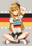  1girl ;q absurdres arm_up bike_jersey bike_shorts black_gloves blonde_hair blush closed_mouth clothes_writing commentary english_commentary fingerless_gloves flag_background flag_print full_body german_flag gloves green_eyes highres komeo15 looking_at_viewer multicolored multicolored_background one_eye_closed original short_sleeves sitting slit_pupils smile solo sportswear star_(symbol) straight_hair tongue tongue_out v white_footwear 