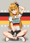  1girl ;q absurdres arm_up bike_jersey bike_shorts black_gloves blonde_hair blush closed_mouth clothes_writing fingerless_gloves flag_background flag_print full_body german_flag gloves green_eyes highres komeo15 looking_at_viewer multicolored multicolored_background one_eye_closed original short_sleeves sitting slit_pupils smile solo sportswear star_(symbol) straight_hair symbol_commentary tongue tongue_out v white_footwear 