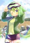  1girl animal_ears arms_up bangs black_legwear black_shorts blurry blurry_background blush cat_ears cat_girl cat_tail commentary_request depth_of_field eyebrows_visible_through_hair goggles goggles_on_head green_eyes green_hair green_jacket green_sweater grin hair_between_eyes jacket kouu_hiyoyo long_sleeves looking_at_viewer one_eye_closed open_clothes open_jacket original puffy_long_sleeves puffy_sleeves short_shorts shorts smile solo sweater tail thigh-highs 
