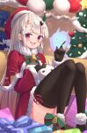  1girl :d bell black_gloves black_legwear blush bow bowtie capelet christmas christmas_ornaments christmas_tree commentary_request fang fur-trimmed_capelet fur-trimmed_sleeves fur_trim gift gloves hat highres hololive horns indoors long_hair looking_at_viewer merry_christmas multicolored_hair nakiri_ayame namaonpa night oni_horns open_mouth poyoyo_(nakiri_ayame) red_eyes redhead santa_costume santa_hat sitting smile streaked_hair thigh-highs virtual_youtuber white_hair 