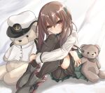  1girl bike_shorts black_legwear black_shorts brown_eyes brown_hair commentary_request green_skirt headband headgear kantai_collection kasashi_(kasasi008) looking_at_viewer pleated_skirt shorts skirt smile stuffed_animal stuffed_toy taihou_(kantai_collection) teddy_bear thigh-highs 