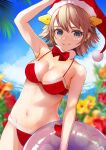  1girl bikini blue_eyes blue_sky blurry brown_hair clouds commentary_request cowboy_shot cryptogam day depth_of_field flipped_hair flower fur-trimmed_bikini fur_trim hairband headgear hiei_(kantai_collection) highres innertube kantai_collection looking_at_viewer outdoors palm_leaf red_bikini short_hair sky solo swimsuit 