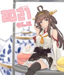  1girl ahoge alakoala artist_name boots brown_hair commentary_request detached_sleeves double_bun food green_eyes hairband hakama_skirt headgear highres japanese_clothes kantai_collection kongou_(kancolle) long_hair macaron oversized_object remodel_(kantai_collection) ribbon-trimmed_sleeves ribbon_trim sitting solo teapot thigh-highs thigh_boots tongue tongue_out 
