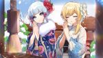  2girls absurdres bangs bare_tree blonde_hair blue_eyes blue_hair blue_sky blunt_bangs closed_eyes closed_mouth commentary floral_print flower fur_collar genshin_impact hair_between_eyes hair_flower hair_ornament hair_ribbon hands_together highres japanese_clothes kamisato_ayaka_(genshin_impact) kimono looking_at_viewer lumine_(genshin_impact) multiple_girls obi official_art open_mouth outdoors praying red_flower ribbon rope sash shrine sky snow sparkle tassel tree white_flower wide_sleeves 