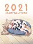 1girl 2021 40hara :3 animal_collar animal_ears animal_print barefoot blonde_hair blush_stickers cat_ears cat_girl cat_tail closed_eyes collar commentary_request cow_print happy_new_year highres kinako_(40hara) long_hair new_year original oversized_clothes oversized_shirt pet_bed red_collar shirt sleeping solo t-shirt tail