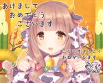  1girl :d animal_ears animal_print bangs bare_shoulders bell bell_choker black_choker blush bow breasts brown_eyes brown_hair caramel_(caramelmilk) choker commentary_request cow_ears cow_horns cow_print detached_sleeves eyebrows_visible_through_hair hair_bow hands_up holding horns kadomatsu long_hair long_sleeves medium_breasts new_year open_mouth original pennant print_bow print_sleeves signature sleeveless sleeves_past_wrists smile solo string_of_flags translation_request upper_body white_bow white_sleeves 