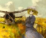  1girl aircraft airplane back_bow black_eyes blonde_hair blue_dress bow clouds commentary day dress field hat highres holding holding_rock kaigen_1025 long_sleeves looking_at_viewer maribel_hearn mob_cap outdoors rock short_hair solo touhou upper_body white_headwear wind 