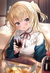  1girl bangs bed blonde_hair blue_eyes blurry blurry_background blush bottle chips cola commentary_request cup curtains food frilled_shirt frills highres holding holding_cup indoors jacket jacket_on_shoulders kanda_done kotatsu long_hair long_sleeves looking_at_viewer open_mouth original ribbon shirt sitting soda soda_bottle solo table twintails white_shirt 