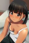  1girl absurdres bangs bed black_hair black_pants blurry blurry_background blush breasts brown_eyes camisole depth_of_field downblouse eyebrows_visible_through_hair highres indoors looking_at_viewer matsunaga_kouyou nose_blush on_bed original pants parted_lips sitting small_breasts solo tan tanline white_camisole 