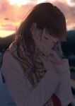  1girl absurdres bangs blurry blurry_background brown_hair cellphone clouds coat commentary_request crying crying_with_eyes_open hand_to_own_mouth highres holding holding_phone long_hair looking_down mole mole_under_eye open_mouth original outdoors phone plaid plaid_scarf saitou_(lynx-shrike) scarf sky smartphone standing sunset tears white_coat 