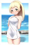  1girl arisu_kazumi artist_name bangs bare_shoulders blonde_hair blue_sky blunt_bangs blurry blurry_background blush braid breasts collarbone commentary_request cropped_legs eyebrows_visible_through_hair french_braid green_eyes hands_on_own_chest high_ponytail lillie_(pokemon) long_hair looking_at_viewer naked_towel ocean onsen pokemon pokemon_(game) pokemon_sm shadow sidelocks sky small_breasts smile solo standing towel wading water wet 