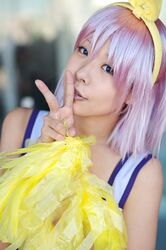   cheerleader cosplay hair_bow hiiragi_tsukasa lucky_star maritsuki_haru photo pom_poms purple_hair  