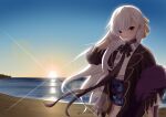  1girl azur_lane bangs belfast_(azur_lane) choker closed_mouth eyebrows_visible_through_hair flat_chest gloves hair_ornament hand_up highres lens_flare long_hair looking_at_viewer new_year ribbon shinka_(yonkun121) sky sunrise touching_ears violet_eyes water white_hair 