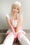  blonde_hair cosplay dream_of_doll nurse nurse_uniform photo thigh-highs twingky yuuna zettai_ryouiki 