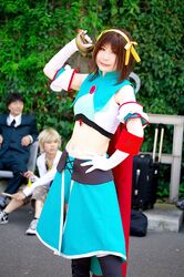  armband cape cosplay hair_ribbons halter_top leggings midriff ousawa_karin photo suzumiya_haruhi suzumiya_haruhi_no_tomadoi suzumiya_haruhi_no_yuuutsu sword 