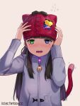 1girl animal_ears animal_hat arm_up bangs beanie bell black_hair blue_eyes blush cat_ears cat_hat cat_tail commentary_request facial_mark fake_animal_ears fangs flying_sweatdrops green_eyes grey_jacket hand_up hat heterochromia highres jacket jingle_bell liclac long_hair long_sleeves open_mouth original red_headwear solo tail tail_raised upper_body watermark web_address 