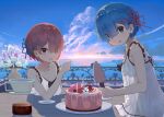  2girls absurdres akatsuki_(m12778387) alternate_costume bangs bare_arms bare_shoulders blue_eyes blue_hair blue_sky blunt_bangs blush breasts cake clouds collarbone commentary_request cup day dress eyebrows_visible_through_hair flower food glass hair_ornament hair_over_one_eye hair_ribbon highres holding holding_cup horizon looking_at_viewer multiple_girls ocean open_mouth outdoors pink_hair pink_ribbon plant plate ram_(re:zero) re:zero_kara_hajimeru_isekai_seikatsu red_eyes rem_(re:zero) ribbon see-through short_hair siblings sisters sky sleeveless sleeveless_dress smile table twins white_flower x_hair_ornament 