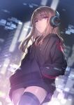  1girl bangs black_legwear blurry blurry_background brown_hair closed_mouth dutch_angle eyebrows_visible_through_hair hands_in_pockets headphones highres hisasi long_hair looking_at_viewer original pink_eyes solo thigh-highs 