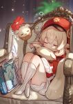  1girl ahoge bad_leg blonde_hair bloomers blush book brat cabbie_hat chair closed_eyes dress feathers full_body genshin_impact gloves hat highres hug indoors klee_(genshin_impact) long_sleeves open_mouth pillow red_dress red_headwear short_twintails sleeping socks twintails underwear zzz 