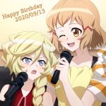  2girls bare_shoulders black_gloves blonde_hair blue_eyes blush braid braided_ponytail brown_eyes carol_malus_dienheim collarbone dated elbow_gloves gloves hair_ornament happy_birthday highres looking_at_another microphone miyumitu_rsm multiple_girls one_eye_closed open_mouth ponytail senki_zesshou_symphogear shiny shiny_hair short_hair simple_background smile tachibana_hibiki_(symphogear) teeth upper_body upper_teeth white_background 