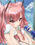  1girl applepie_(12711019) azur_lane bangs bare_shoulders blush bottle breasts bremerton_(azur_lane) bremerton_(scorching-hot_training)_(azur_lane) chain-link_fence fence hair_ornament hairclip highres large_breasts long_hair multicolored_hair open_mouth pink_eyes pink_hair sleeveless solo sportswear streaked_hair sweat towel twintails water_bottle x_hair_ornament 