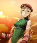  1girl ahoge aqua_eyes bare_shoulders blonde_hair braid breasts cammy_white clenched_hands clouds covered_navel enami_katsumi fingerless_gloves garrison_cap gloves green_leotard harness hat highres leotard long_hair looking_away medium_breasts parted_lips red_gloves red_headwear scar scar_on_cheek scar_on_face sky sleeveless solo standing street_fighter street_fighter_v sunset thong_leotard twin_braids 