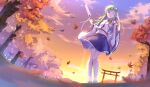  1girl autumn autumn_leaves backlighting bangs bird blue_skirt blurry clouds collared_shirt colored_eyelashes depth_of_field detached_sleeves forest from_below gohei gradient_sky green_eyes green_hair hair_between_eyes hand_in_hair highres hip_focus katee knees kochiya_sanae legs long_hair looking_at_viewer looking_down midriff mountainous_horizon nature one_eye_closed oonusa open_mouth outdoors perspective petticoat pigeon-toed pink_sky polka_dot_skirt purple_sky reflective_eyes shiny shiny_hair shirt skirt sky sleeveless sleeveless_shirt solo standing sunset torii touhou tree twilight white_legwear white_shirt white_sleeves wide_sleeves wind yellow_sky 