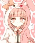  1girl animal_ears animal_hood bangs blush_stickers bunny_hood collared_shirt commentary_request cosplay dangan_ronpa_(series) dangan_ronpa_2:_goodbye_despair dress_shirt fake_animal_ears hood hood_up light_brown_hair looking_at_viewer mari_audio monomi_(dangan_ronpa) monomi_(dangan_ronpa)_(cosplay) nanami_chiaki neck_ribbon pink_background pink_eyes pink_hair pink_ribbon pout rabbit_ears ribbon shiny shiny_hair shirt solo translation_request upper_body white_background 