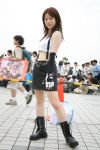  1girl asian bag belt boots cone construction convention cosplay crowd final_fantasy final_fantasy_vii fingerless_gloves gloves laces midriff miniskirt orange_cone overcast photo real_person shouka stare suspenders tank_top tifa_lockhart traffic_cone 