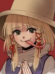  1girl bangs blonde_hair closed_mouth commentary_request eyebrows_visible_through_hair face frog_girl hair_ribbon hands_clasped hands_together hat highres kuya_(hey36253625) long_tongue looking_at_viewer moriya_suwako own_hands_together purple_vest red_background red_ribbon ribbon shirt short_hair simple_background smile solo tongue tongue_out touhou turtleneck upper_body vest white_shirt yellow-framed_eyewear yellow_eyes 