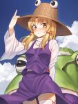  1girl absurdres animal arm_up bangs blonde_hair blue_sky blush brown_eyes brown_headwear closed_mouth clouds commentary_request day eyebrows_visible_through_hair frog goback hand_on_headwear hat highres long_hair long_sleeves looking_at_viewer moriya_suwako outdoors oversized_animal parted_bangs purple_skirt purple_vest shirt skirt skirt_set sky solo thigh-highs touhou turtleneck vest white_legwear white_shirt wide_sleeves 